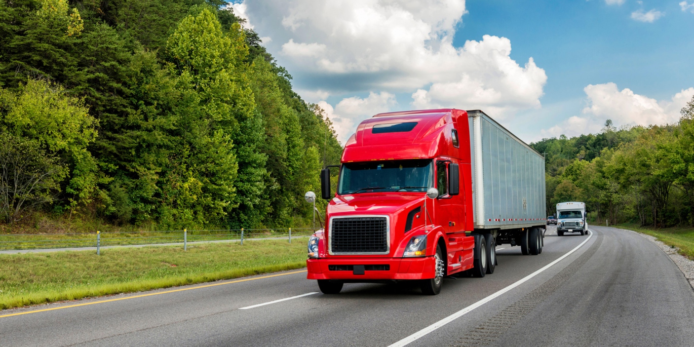 Full Truckload FTL shipping service offered by Uplift Express Ltd with a large truck on a highway