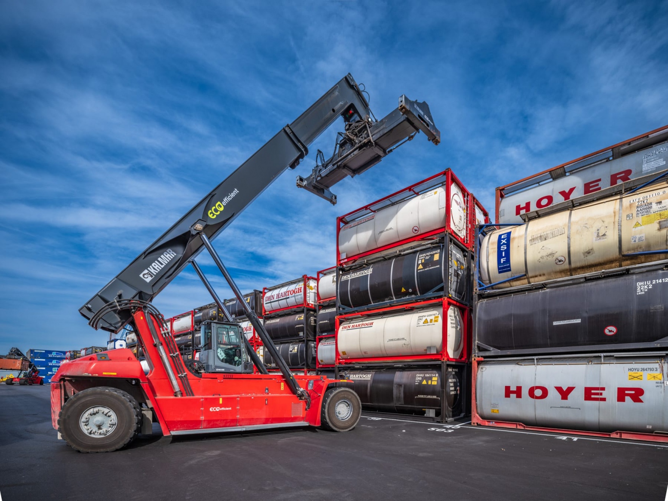 Illustration showing a train and truck connecting shipping containers for intermodal transport solutions.