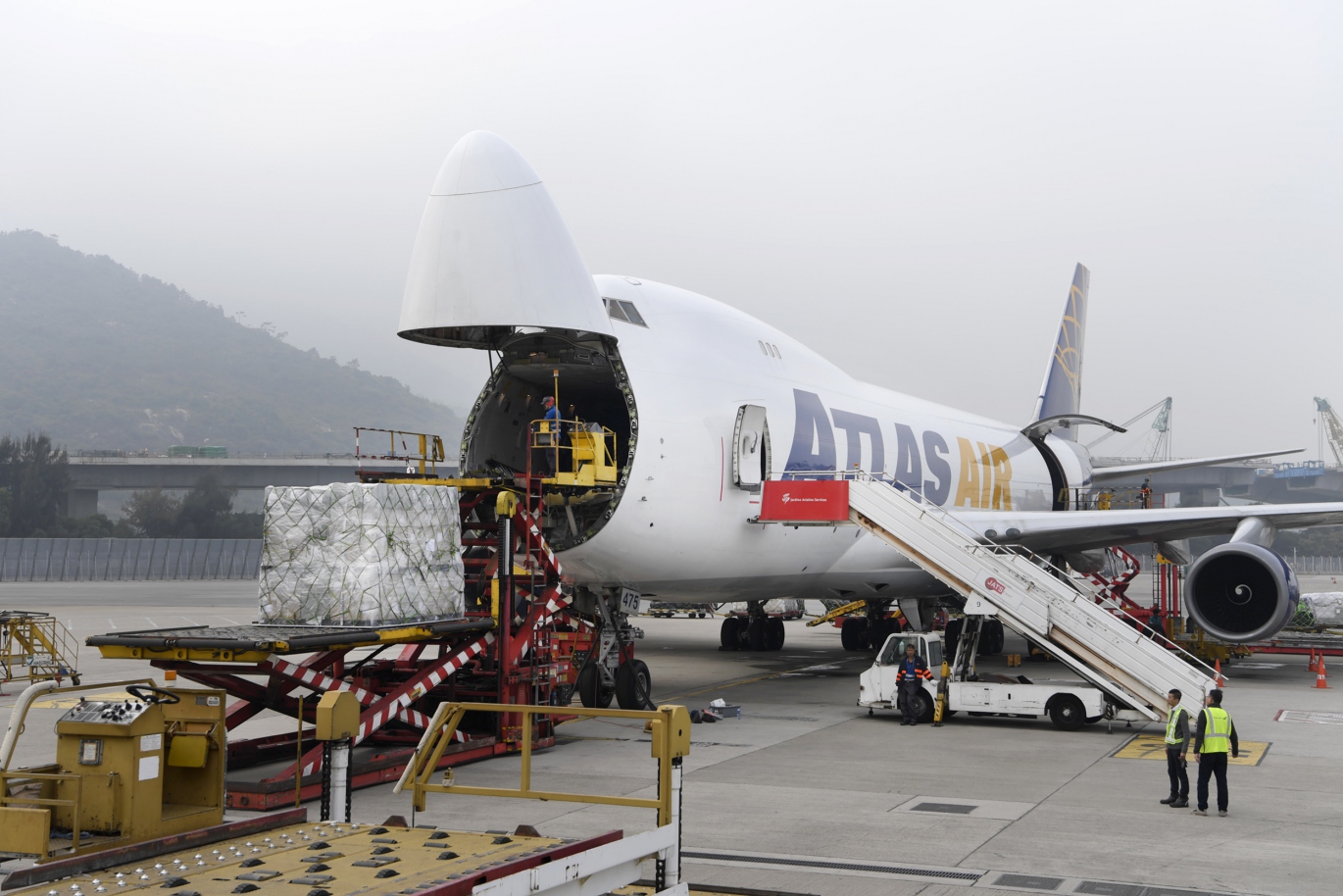 Shipment of perishable goods and high value cargo being handled with care by logistics professionals